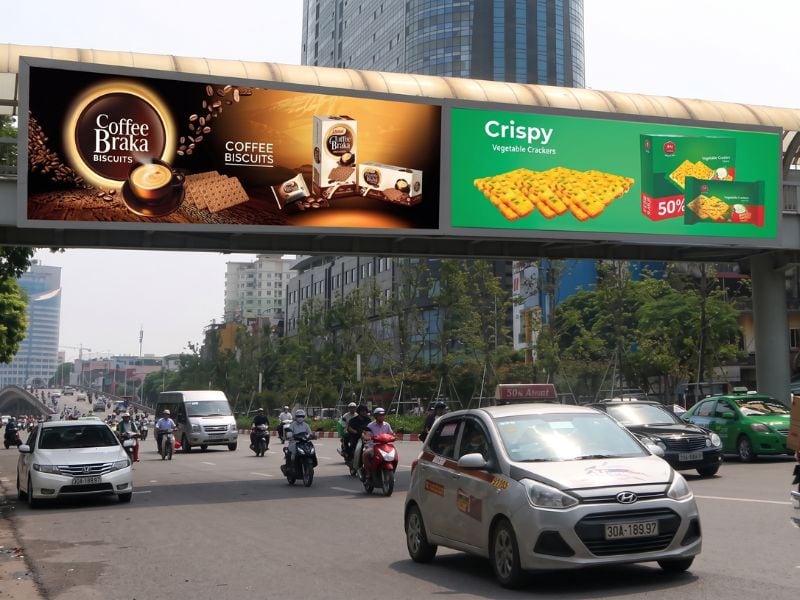 Biển đèn Led quảng cáo bánh kẹo trên cầu vượt đi bộ - Quảng cáo trên cầu vượt đi bộ: Ưu điểm, chi phí & lưu ý Biển đèn Led quảng cáo bánh kẹo trên cầu vượt đi bộ